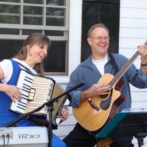 Donna & Andy - accordion and guitar - musical fun for everyone Donna & Andy having fun playing at the Garden Party